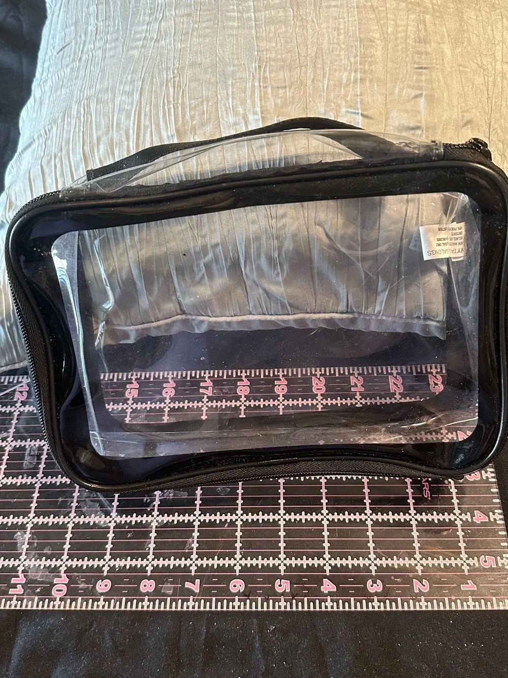 Clear PVC cosmetic/toiletry bag with black trim